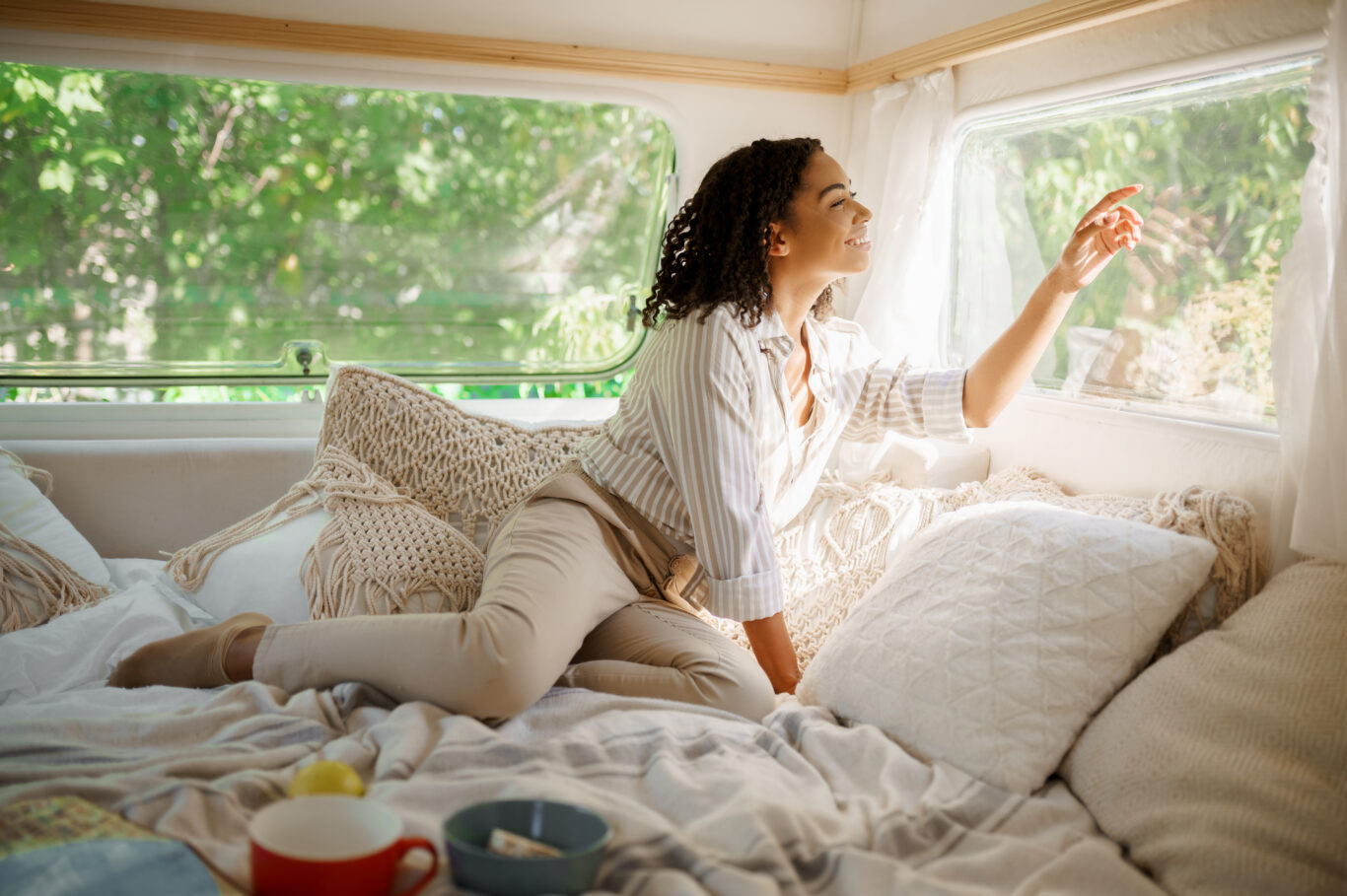 Smiling Woman Relax In Bed, Camping In A Trailer